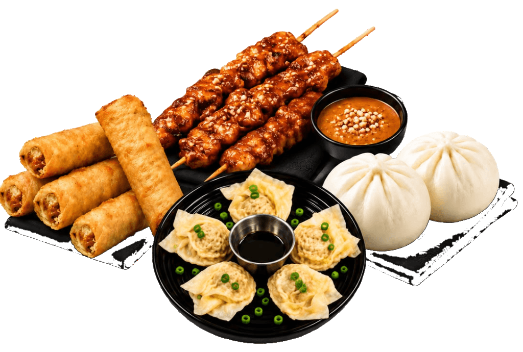 Assortiment de nems, satay, raviolis et bánh bao
