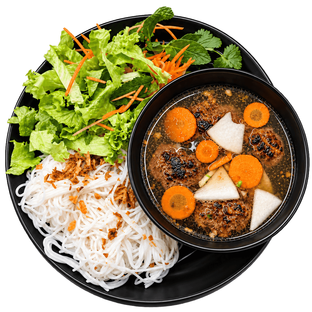 Bol de bún chả avec boulettes et herbes